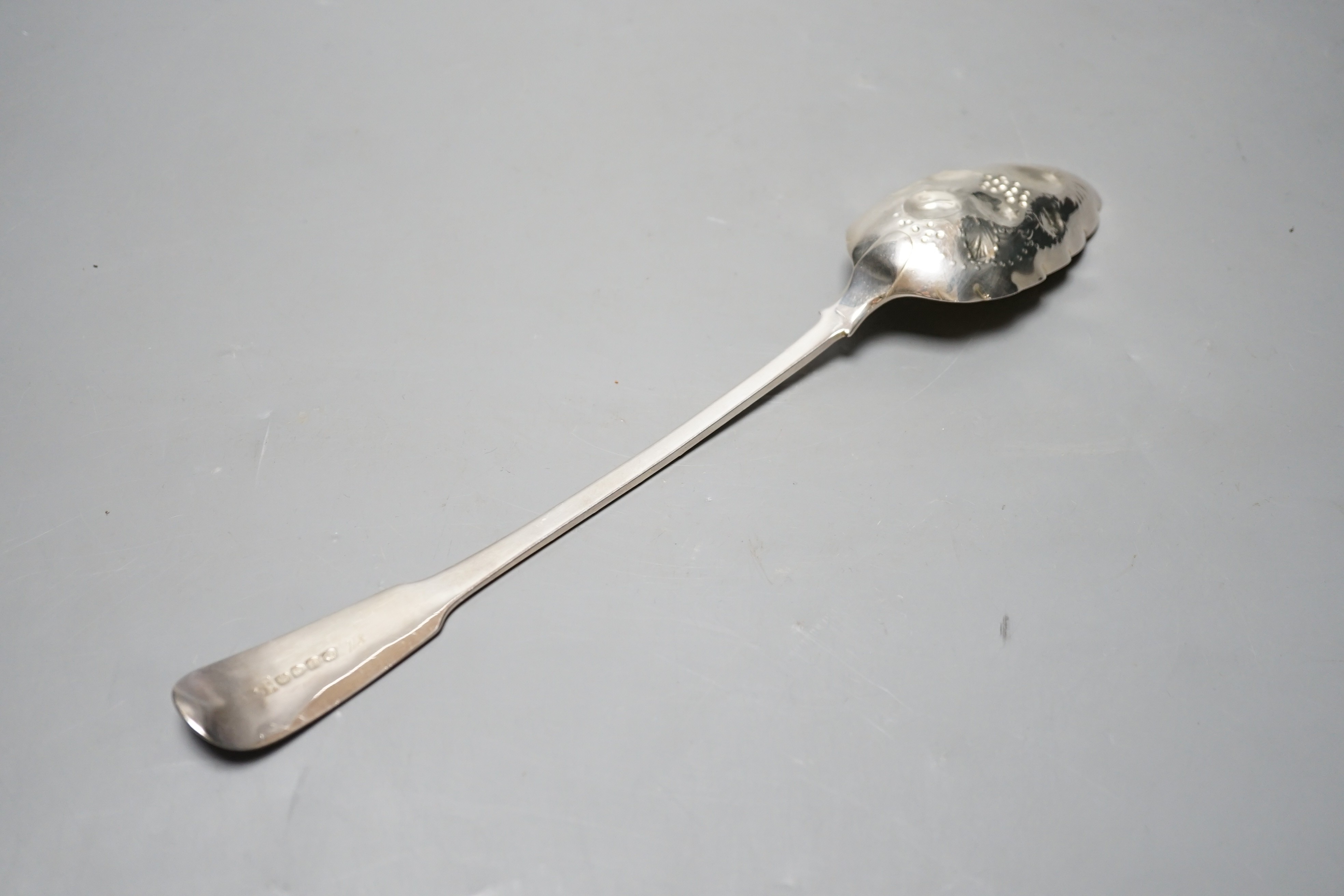 A late George III silver fiddle pattern embossed 'berry' basting spoon, Eley & Fearn, London, 1817, 30.6cm, 113 grams.